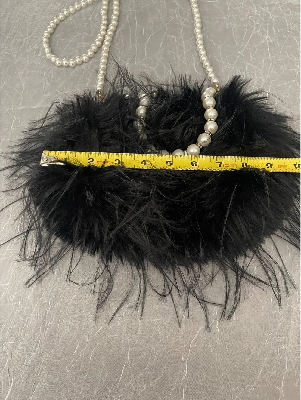 Black Faux Feather Purse with Prominent Pearl Strap.